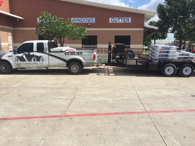 Roofing crew delivering architectural shingles | Genes Construction Genes Construction roofing truck towing a trailer of architectural shingles for a Dallas–Fort Worth roof replacement
